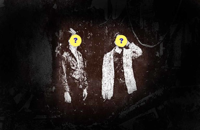 Two Men Standing in Rubble